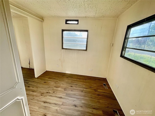 101 5th St, Starbuck, WA 99359 - unfurnished room featuring wood finished floors and wood walls