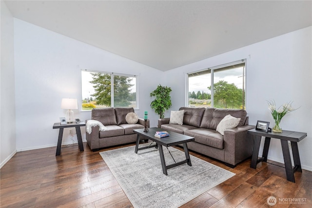 727 Salzburg Ln SE, Olympia, WA 98513 - living room with healthy amount of natural light, vaulted ceiling, dark wood-style flooring, and baseboards