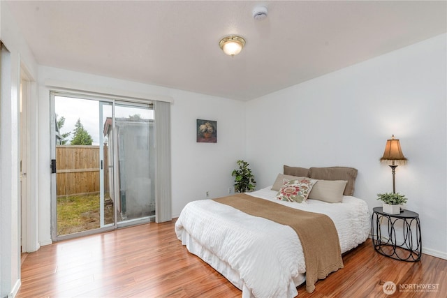 727 Salzburg Ln SE, Olympia, WA 98513 - bedroom featuring access to exterior and wood finished floors