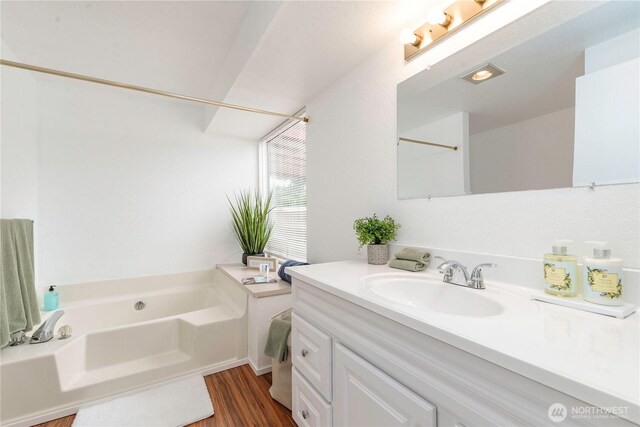 727 Salzburg Ln SE, Olympia, WA 98513 - full bath featuring a garden tub, vanity, and wood finished floors