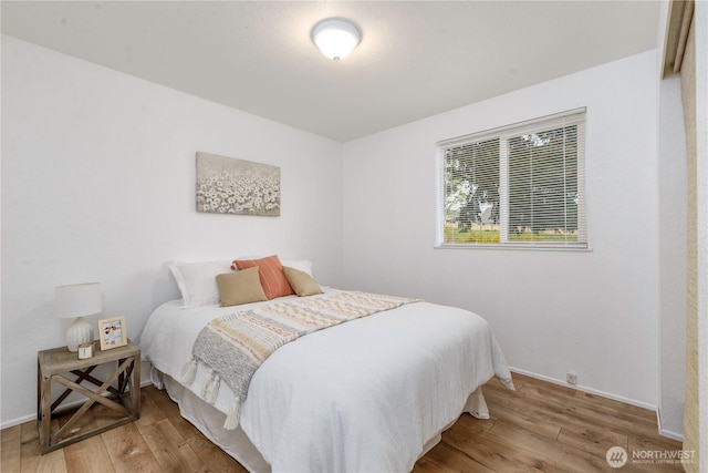 727 Salzburg Ln SE, Olympia, WA 98513 - bedroom with wood finished floors and baseboards