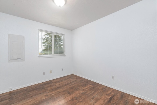727 Salzburg Ln SE, Olympia, WA 98513 - spare room featuring dark wood finished floors, baseboards, and electric panel