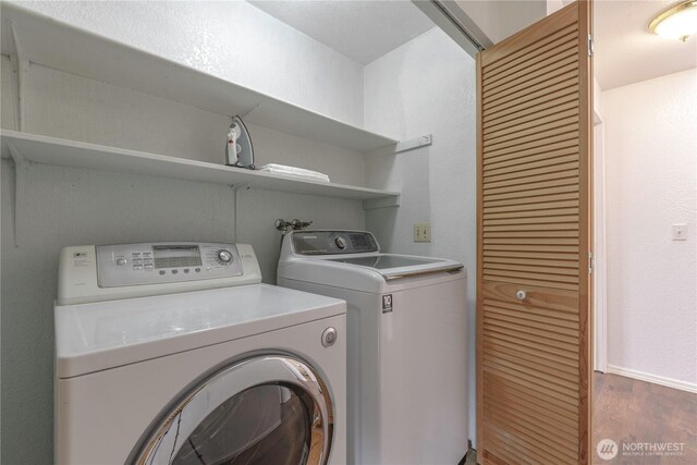 727 Salzburg Ln SE, Olympia, WA 98513 - laundry room featuring washing machine and dryer, wood finished floors, and baseboards