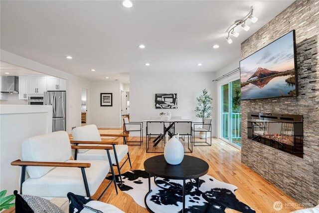 2333 NE 94th St, Seattle, WA 98115 - dining space with light wood finished floors, recessed lighting, and a stone fireplace