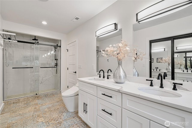 2333 NE 94th St, Seattle, WA 98115 - full bath featuring a shower stall, toilet, double vanity, and recessed lighting