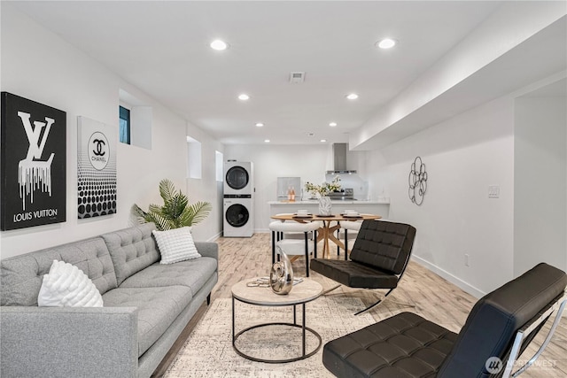 2333 NE 94th St, Seattle, WA 98115 - living area featuring estacked washer and dryer, recessed lighting, light wood-type flooring, and baseboards