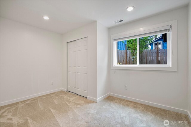 2333 NE 94th St, Seattle, WA 98115 - unfurnished bedroom with carpet flooring, baseboards, recessed lighting, and a closet