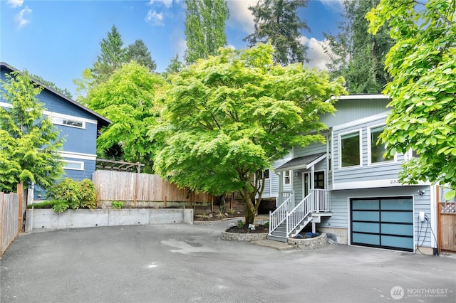 2333 NE 94th St, Seattle, WA 98115 - view of front of home with fence and an attached garage