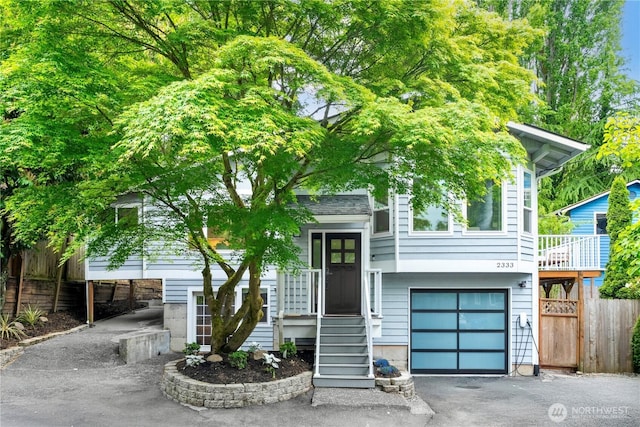 2333 NE 94th St, Seattle, WA 98115 - view of front of property featuring fence, an attached garage, and driveway
