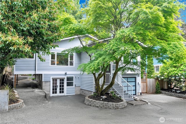 2333 NE 94th St, Seattle, WA 98115 - view of front of home featuring french doors, fence, and a carport