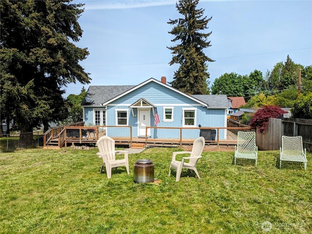 view of front of property with a wooden deck and a shingled roof