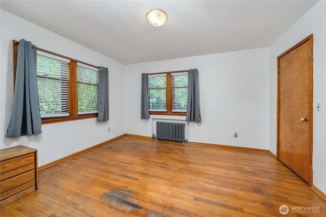 7209 104th St E, Puyallup, WA 98373 - unfurnished room featuring radiator heating unit, wood finished floors, and baseboards