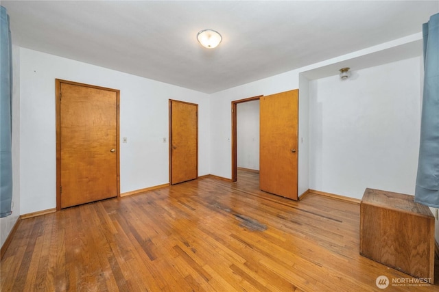 7209 104th St E, Puyallup, WA 98373 - unfurnished bedroom featuring wood finished floors and baseboards