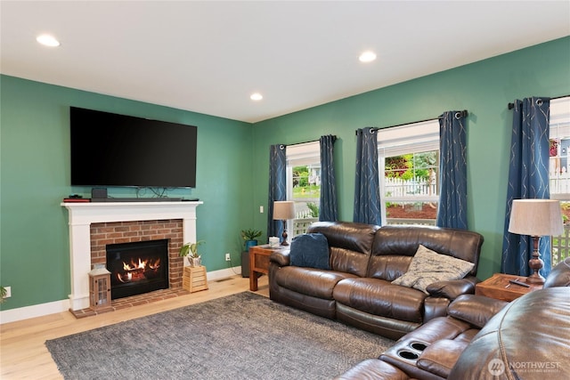 210 E Cedarland Ln, Allyn, WA 98524 - living room with wood finished floors, recessed lighting, baseboards, and a fireplace