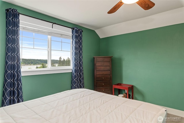 210 E Cedarland Ln, Allyn, WA 98524 - bedroom with vaulted ceiling, a ceiling fan, and baseboards