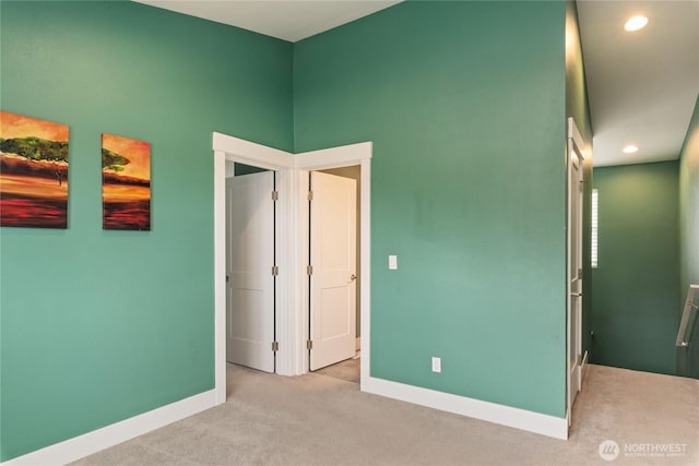 210 E Cedarland Ln, Allyn, WA 98524 - unfurnished bedroom featuring baseboards, carpet floors, and recessed lighting