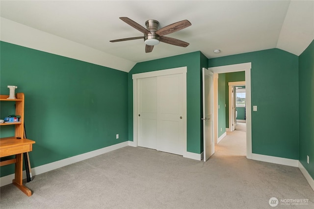 210 E Cedarland Ln, Allyn, WA 98524 - unfurnished bedroom featuring vaulted ceiling, baseboards, carpet flooring, a closet, and ceiling fan