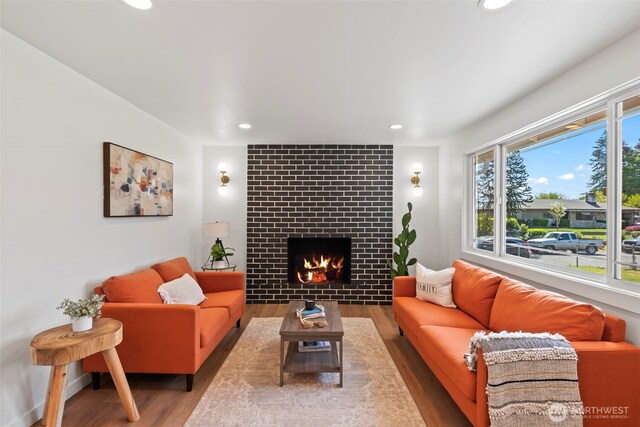 3009 Heath Ct, Steilacoom, WA 98388 - living room featuring wood finished floors, recessed lighting, and a tiled fireplace