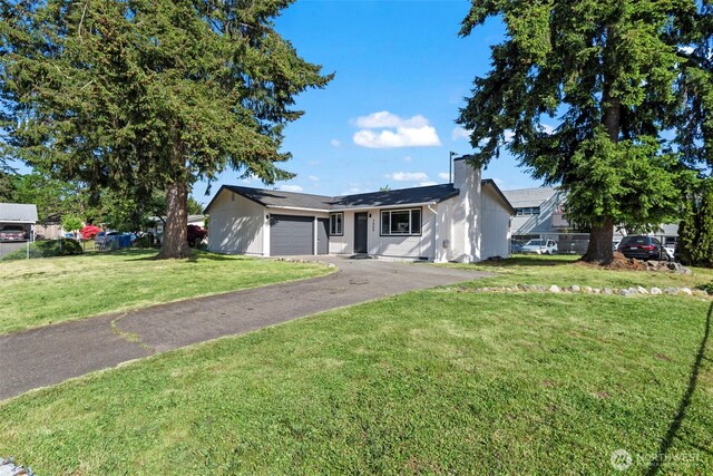 3009 Heath Ct, Steilacoom, WA 98388 - ranch-style home with an attached garage, driveway, a front lawn, and a chimney