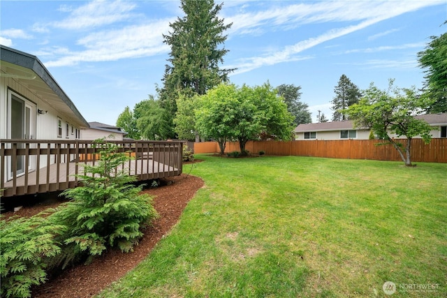 view of yard featuring a wooden deck