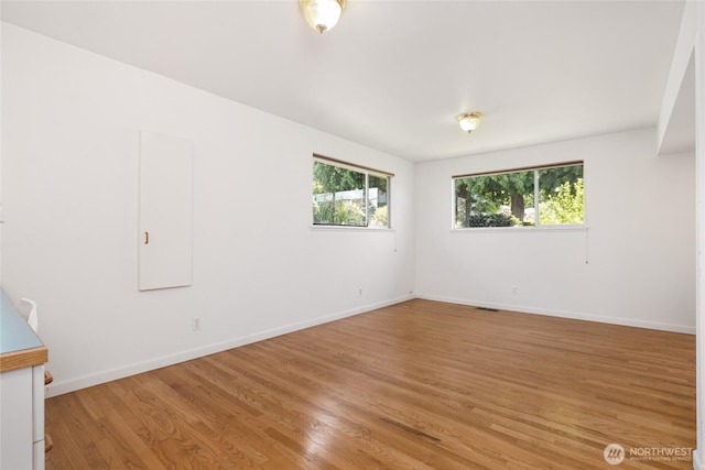 1006 N 36th St, Renton, WA 98056 - unfurnished room with light wood-type flooring and baseboards