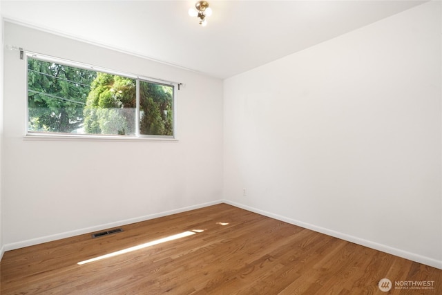 1006 N 36th St, Renton, WA 98056 - unfurnished room featuring wood finished floors and baseboards