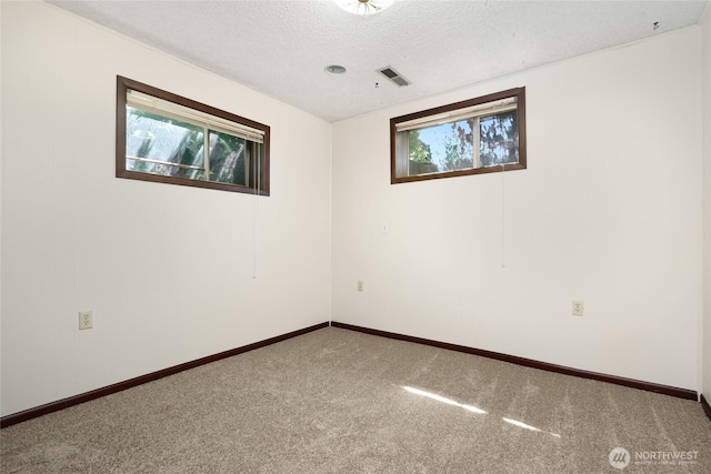 1006 N 36th St, Renton, WA 98056 - carpeted empty room with a textured ceiling and baseboards