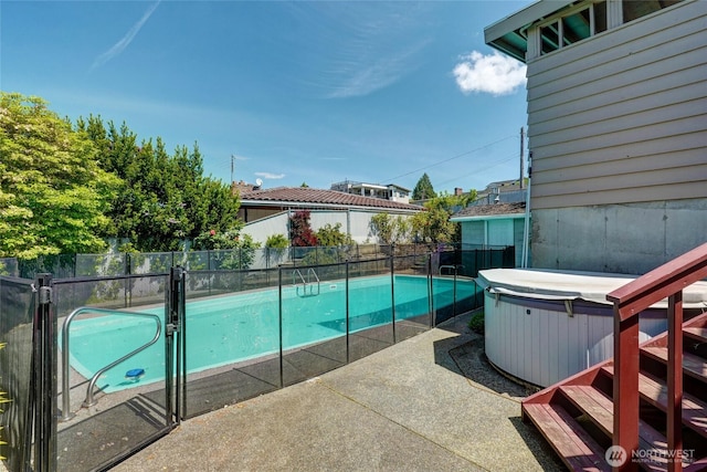 1006 N 36th St, Renton, WA 98056 - view of swimming pool with a hot tub, a fenced backyard, and a patio area