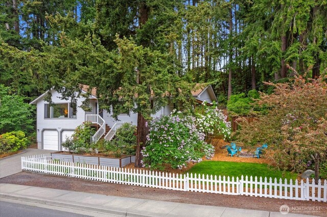 7517 Olympic View Dr, Edmonds, WA 98026 - view of property hidden behind natural elements featuring stairway, asphalt driveway, and a garage
