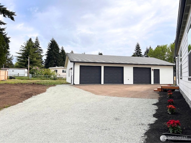 detached garage with fence