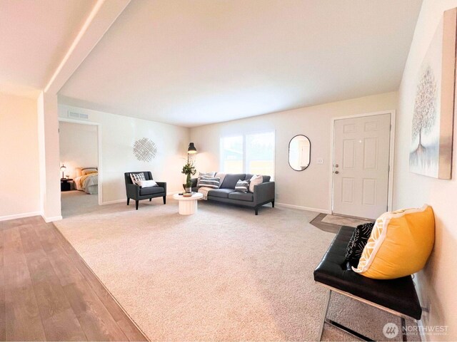 living room with baseboards and wood finished floors