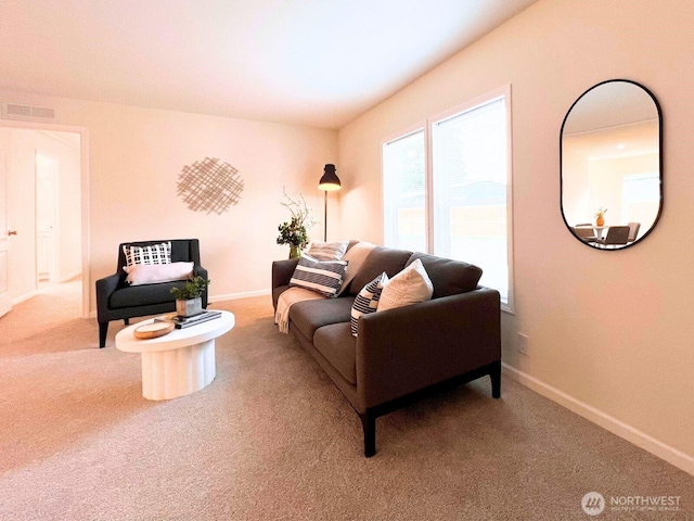 living room with carpet and baseboards