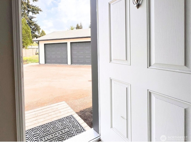 doorway featuring carpet flooring