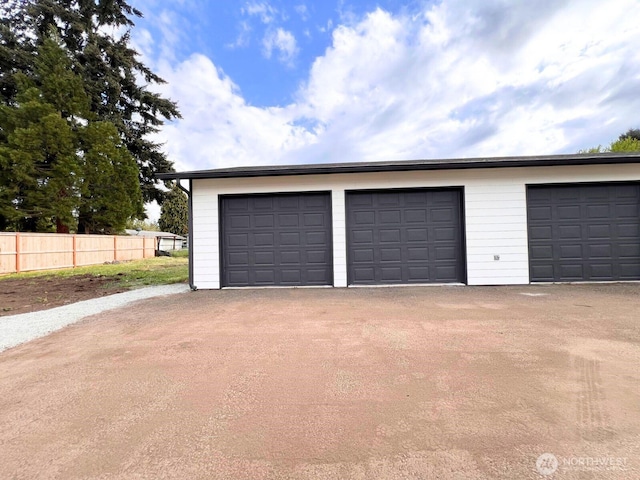 detached garage with fence