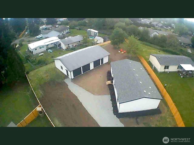 aerial view of property's location with nearby suburban area