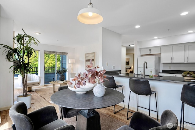 9222 Roosevelt Way NE Unit 302, Seattle, WA 98115 - dining room with wood finished floors and recessed lighting