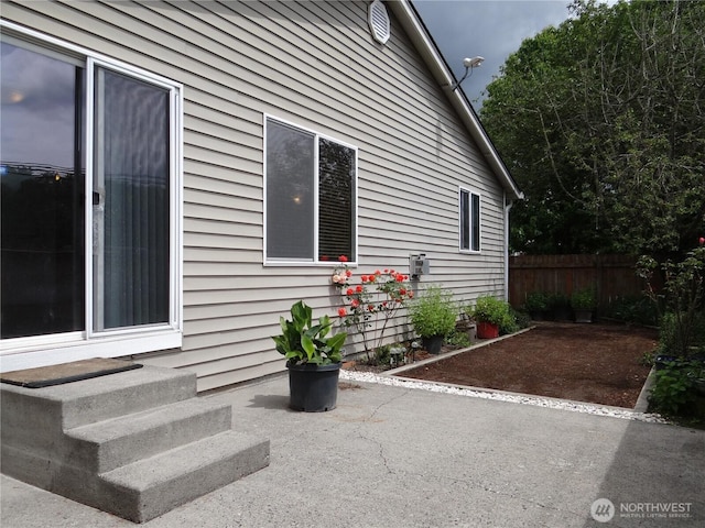 1954 Meadowood Loop, Woodland, WA 98674 - view of home's exterior featuring a patio, entry steps, and fence