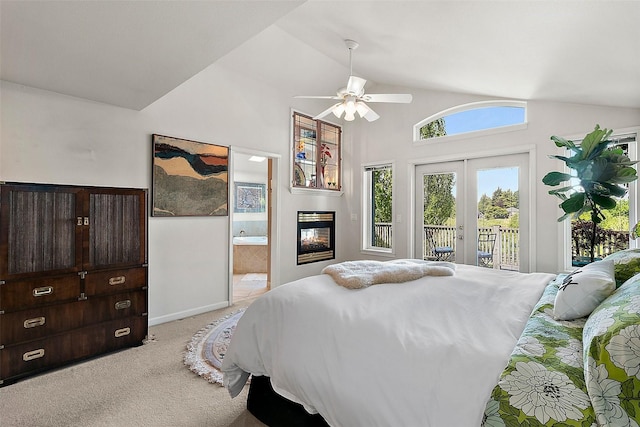 bedroom featuring access to outside, french doors, light colored carpet, connected bathroom, and a multi sided fireplace