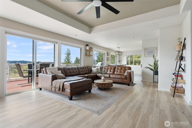 247 Devereese Rd, Chehalis, WA 98532 - living area featuring light wood-style flooring, ceiling fan, baseboards, a tray ceiling, and recessed lighting