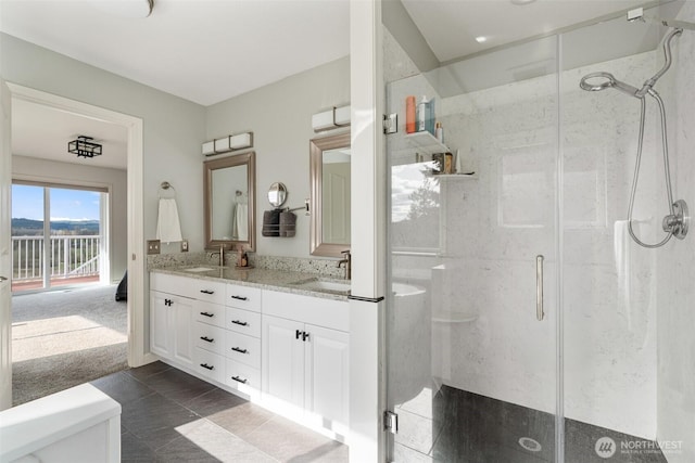 247 Devereese Rd, Chehalis, WA 98532 - full bath with a marble finish shower, double vanity, toilet, and tile patterned flooring