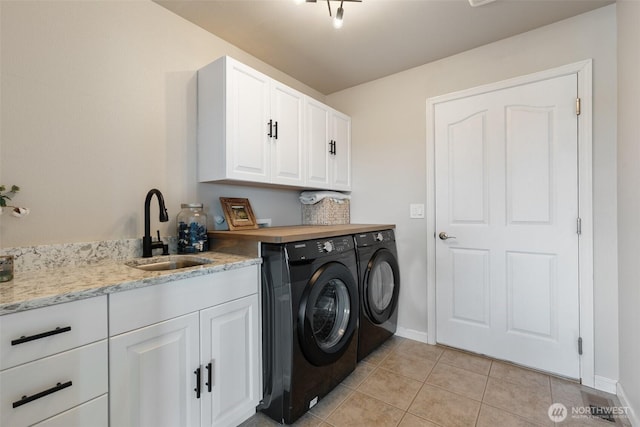 247 Devereese Rd, Chehalis, WA 98532 - laundry room with washing machine and dryer, light tile patterned floors, cabinet space, and baseboards