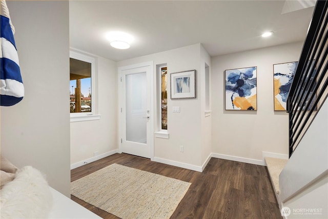 entryway featuring dark wood-style floors, baseboards, and recessed lighting