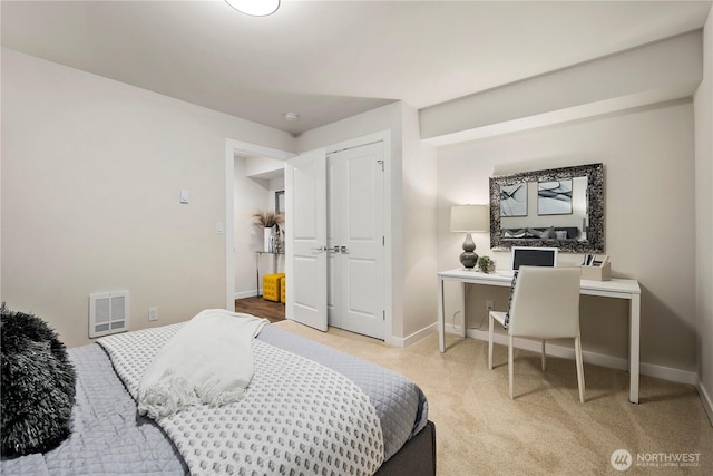 carpeted bedroom with baseboards