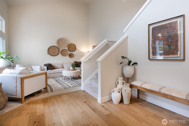 1075 SW 12th St, North Bend, WA 98045 - staircase featuring wood finished floors and baseboards