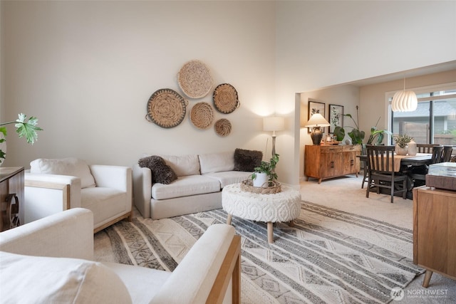 1075 SW 12th St, North Bend, WA 98045 - carpeted living room with a towering ceiling