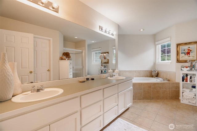 1075 SW 12th St, North Bend, WA 98045 - full bath with tile patterned floors, double vanity, a stall shower, and a garden tub