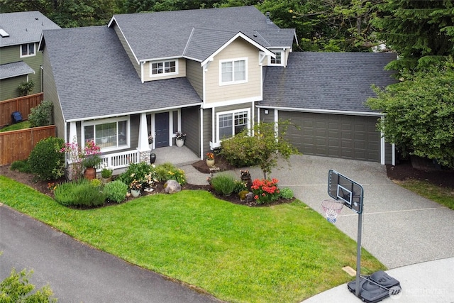 1075 SW 12th St, North Bend, WA 98045 - traditional home with a porch, a garage, concrete driveway, and a shingled roof