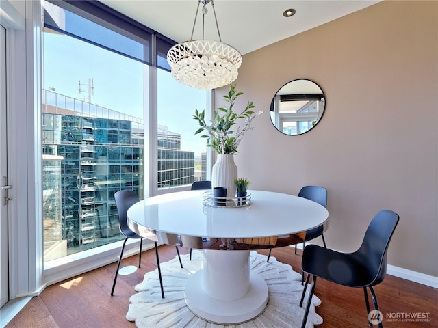 10700 NE 4th St Unit 2710, Bellevue, WA 98004 - dining space with plenty of natural light, wood finished floors, and baseboards