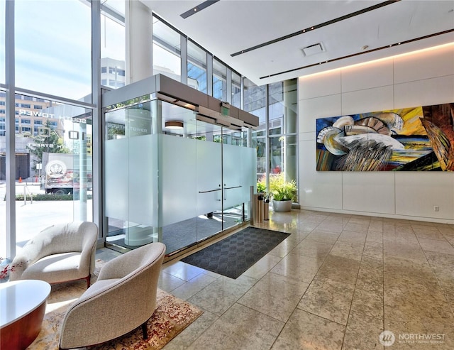 10700 NE 4th St Unit 2710, Bellevue, WA 98004 - building lobby with floor to ceiling windows and a towering ceiling