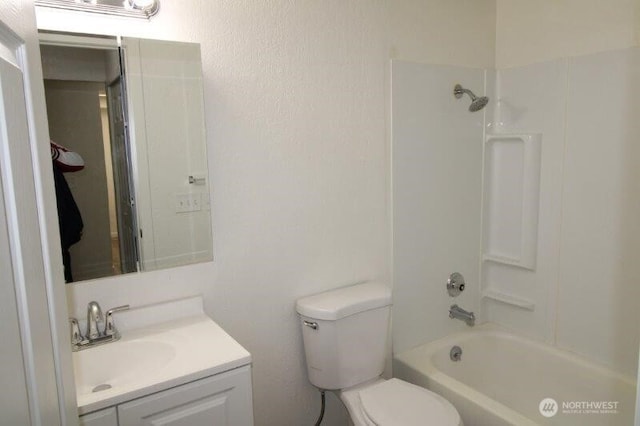 full bath featuring vanity, toilet, and  shower combination